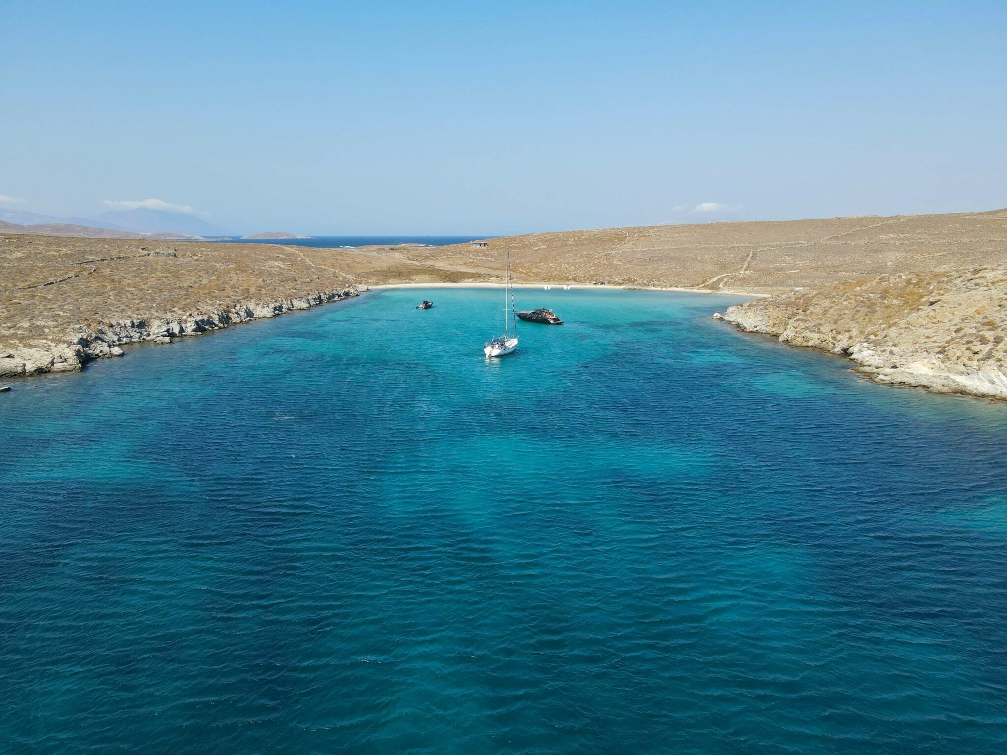 boats anchored in Mykonos secluded bay